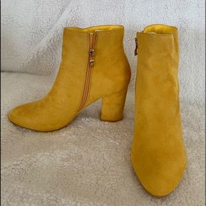 Cute yellow boots that go awesome with jeans. Never worn. Brand new!